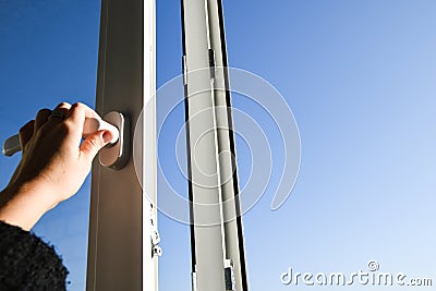 Hand opening plastic vinyl window Stock Photo