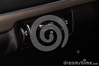 Hand operating ESP (electronic stability program) control close up view. Stock Photo