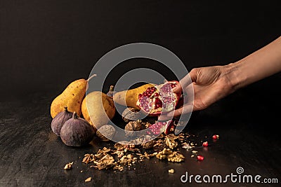 hand with organic autumnal fruits Stock Photo