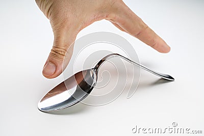 Hand Over The Bend Stainless Steel Spoon Stock Photo