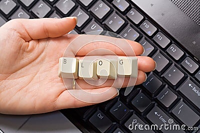 Hand over computer keyboard - blog concept Stock Photo