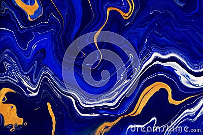 Hand painted background with mixed liquid blue and golden paints. Abstract fluid acrylic painting. Modern art. Marbled Stock Photo