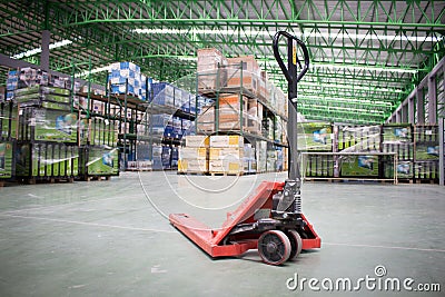 The Hand pallet truck in a warehouse Stock Photo