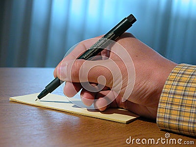 Hand and pen Stock Photo