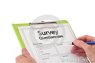 Hand with Pen Completing Market Research Survey Qu Stock Photo