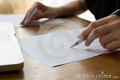 Hand with Pen Proofreading Stock Photo