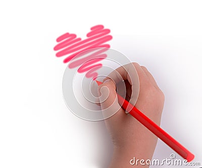 A hand with a pencil draws a heart in red.copyspace for text Stock Photo