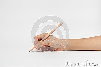 Hand with pencil writting something Stock Photo