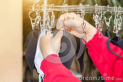 Hand of peple are hold many face masks are washed and dried for reuse anti bacteria and virus make to new face mask, bacteria, Stock Photo