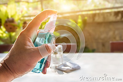 Hand of peple are hold pump bottle applying alcohol gel or anti bacteria soap to make hands cleaning and clear germ, bacteria, Stock Photo