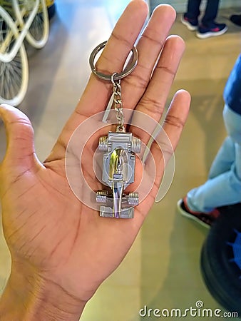 Hand of a person showing Car bijou in jewellery shop. Stock Photo