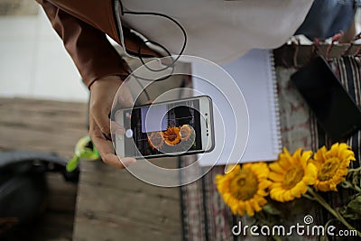Hand with phone camera. Passion concept. Smartphone photographer at work. Capturing flat lay with cell phone Stock Photo