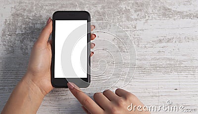 Hand and phone on wooden background Stock Photo