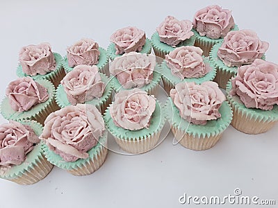 Hand piped buttercream vintage rose cupcakes Stock Photo