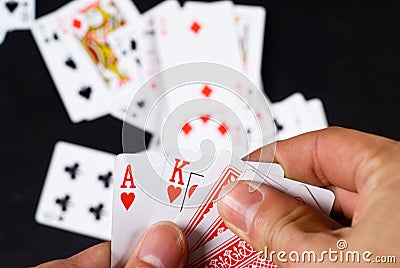 Hand with playing cards Stock Photo