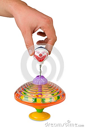 Hand playing colors whirligig isolated Stock Photo