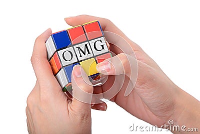 Hand playing Square puzzle to be OMG the well known expression o Editorial Stock Photo