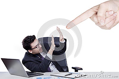 Hand pointing at caucasian businessman Stock Photo