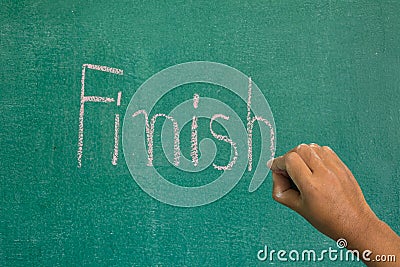 Hand pointing at finish word of success concept Stock Photo