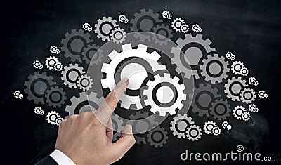 Hand pointing on gearwheel cloud concept Stock Photo