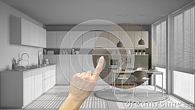 Hand pointing interior design project, home project detail, deciding on rooms furnishing or remodeling concept, modern kitchen wit Stock Photo