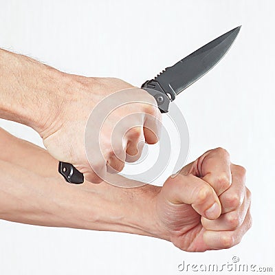 Hand position to attack with a army knife on white background Stock Photo