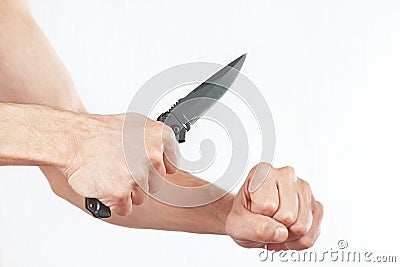 Hand position to attack with a knife on white background Stock Photo