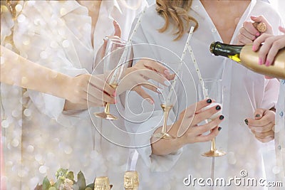 Hand pouring glasses with christmas champagne during the party. Stock Photo