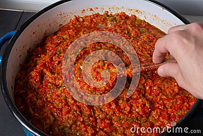 Savor the Flavors: Crafting Homemade Ajvar with Love Stock Photo