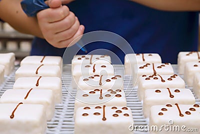 hand prepared iced cakes with chocolate spots Stock Photo