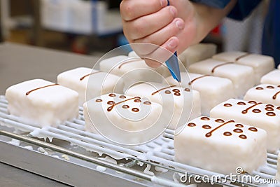 hand prepared iced cakes with dominoes themed chocolate spots Stock Photo