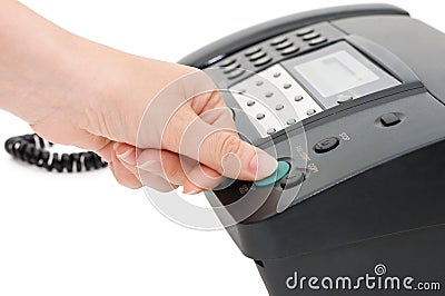 The hand presses the fax button Stock Photo