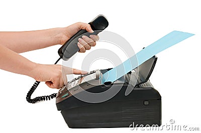 The hand presses the fax button Stock Photo