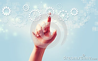 Hand pressing gear icons Stock Photo