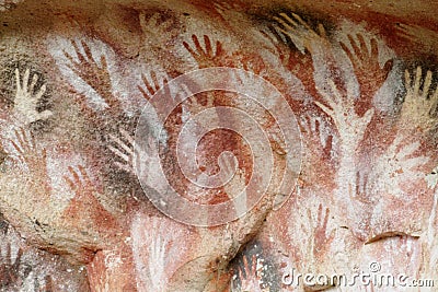 Hand prints on a cave wall Stock Photo