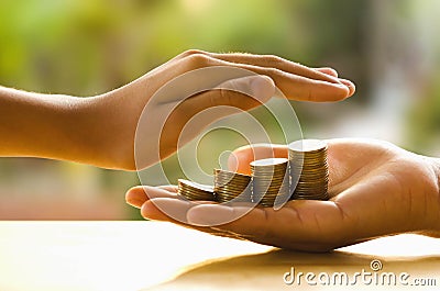 Hand protect money and save money Stock Photo