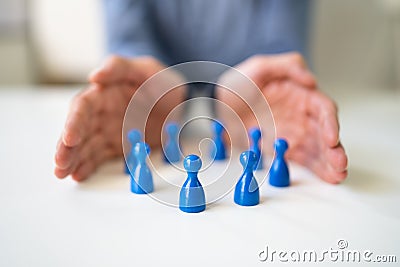 Hand Protecting Inclusive Equal Pawns Stock Photo