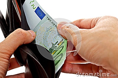 Hand pulling Euro banknote from wallet Stock Photo