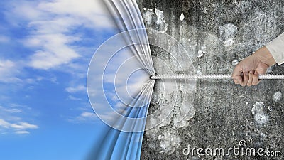Hand pulling natural sky curtain covered old dirty concrete wall Stock Photo