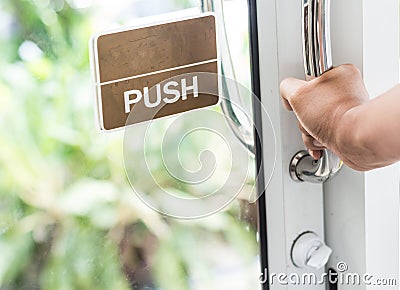 Hand push the door Stock Photo