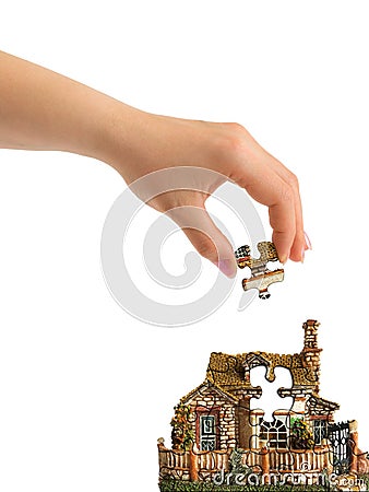 Hand and puzzle house Stock Photo