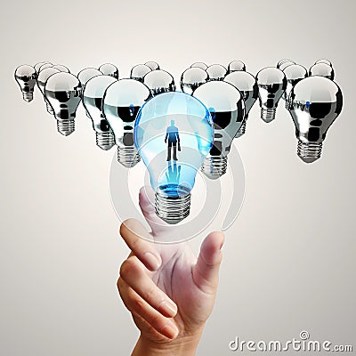 Hand reach 3d light bulb of leadership Stock Photo