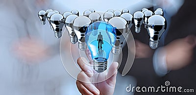 Hand reach 3d light bulb of leadership Stock Photo