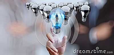 Hand reach 3d light bulb of leadership Stock Photo