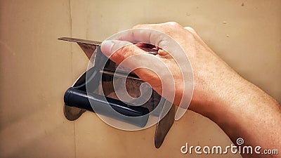 Hand reaching for empty paper roll Stock Photo