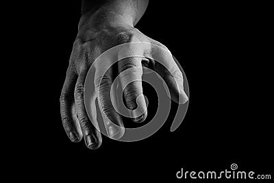 Hand reaching isolated on black background. Conceptual, give me your hand, helping hand concept Stock Photo
