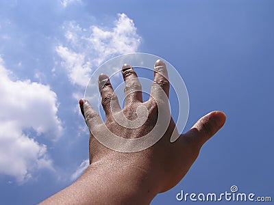 Hand reaching for the sky Stock Photo