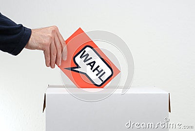 Hand with red envelope - Election german Stock Photo