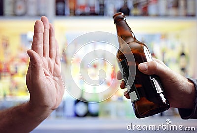 Hand rejecting alcoholic beer beverage Stock Photo