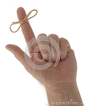 Hand with reminder string on finger Stock Photo